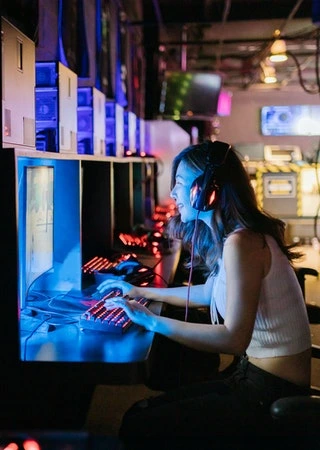 Happy female in front of monitor