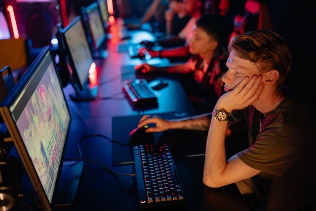 Several people in front of computer